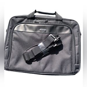 Black never used laptop bag with shoulder and hand straps.